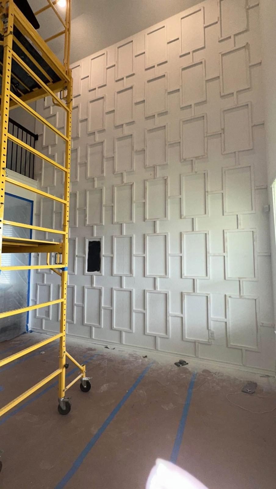 Geometric accent wall during installation