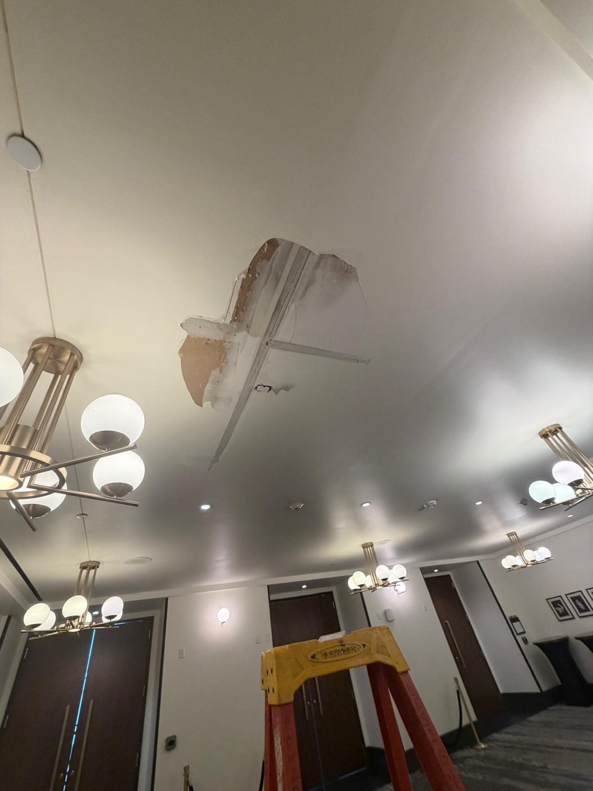 Damaged ceiling before drywall repair